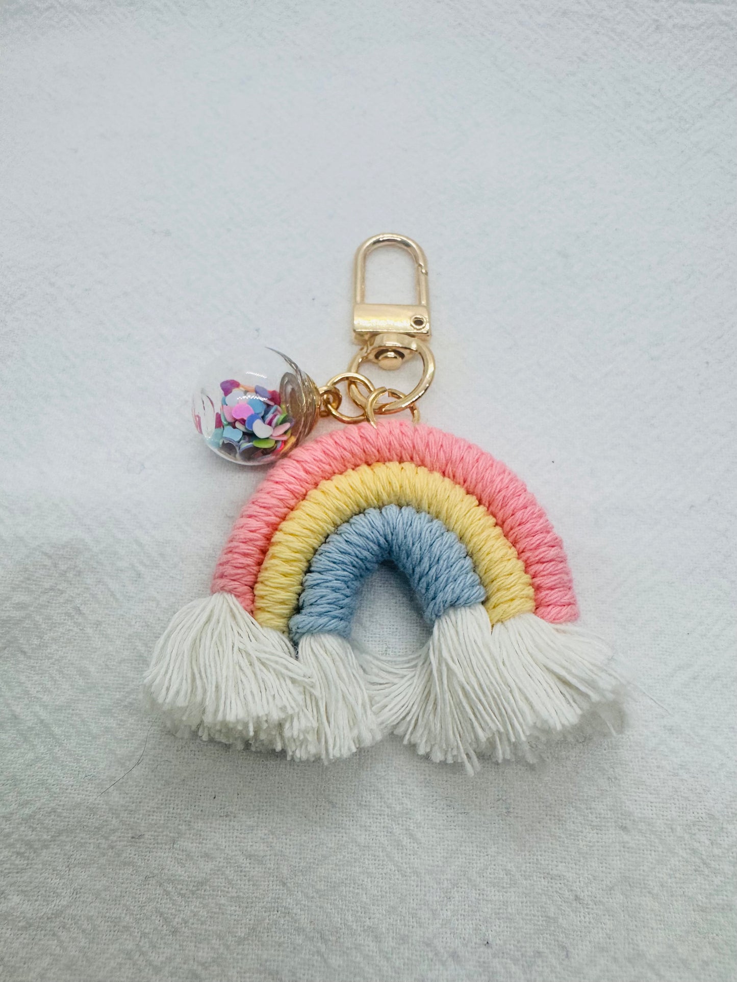 Rainbow-coloured macrame keychain with tassels 